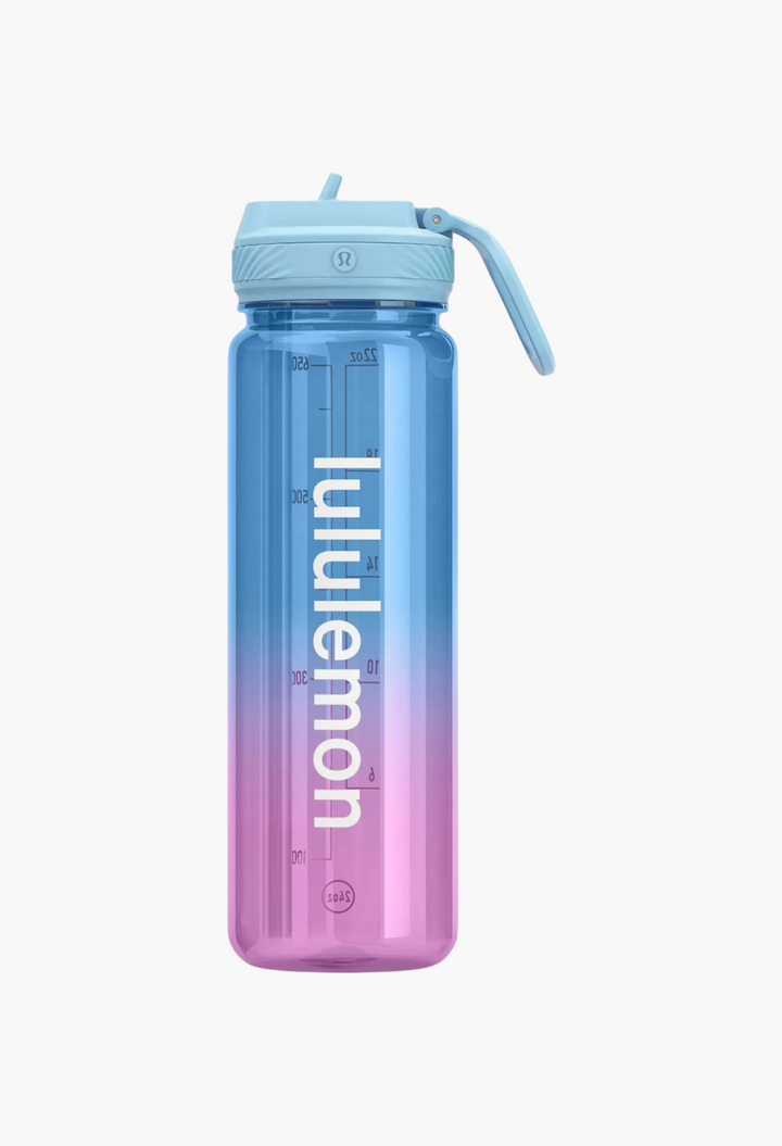 GLAM MODA 24oz clear Tritan water bottle with a blue-to-pink gradient, straw lid, and vertical logo branding.