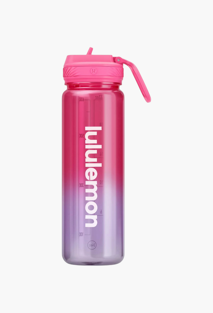 GLAM MODA 24oz clear Tritan water bottle with a pink-to-purple gradient, straw lid, and white logo branding.