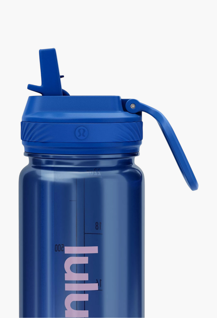 GLAM MODA Back to Life clear blue water bottle with a leakproof straw lid and volume markings for hydration tracking.
