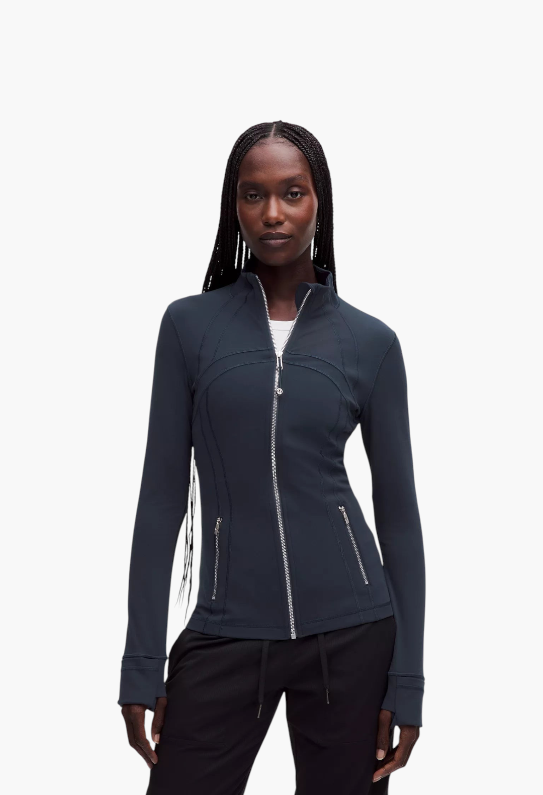 GLAM MODA Define Jacket in dark navy Nulu fabric with a slim fit, high collar, and zippered pockets on a model.