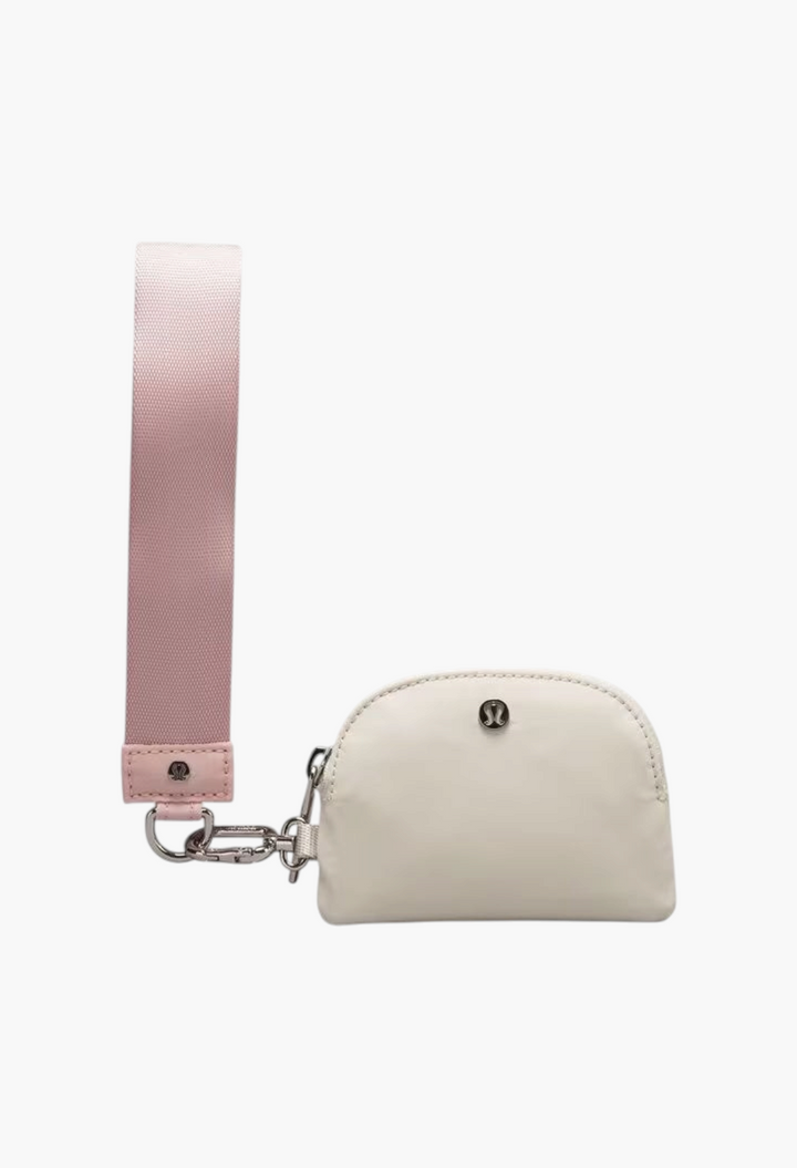 GLAM MODA dual pouch wristlet in off-white with a light pink nylon wrist strap and silver hardware