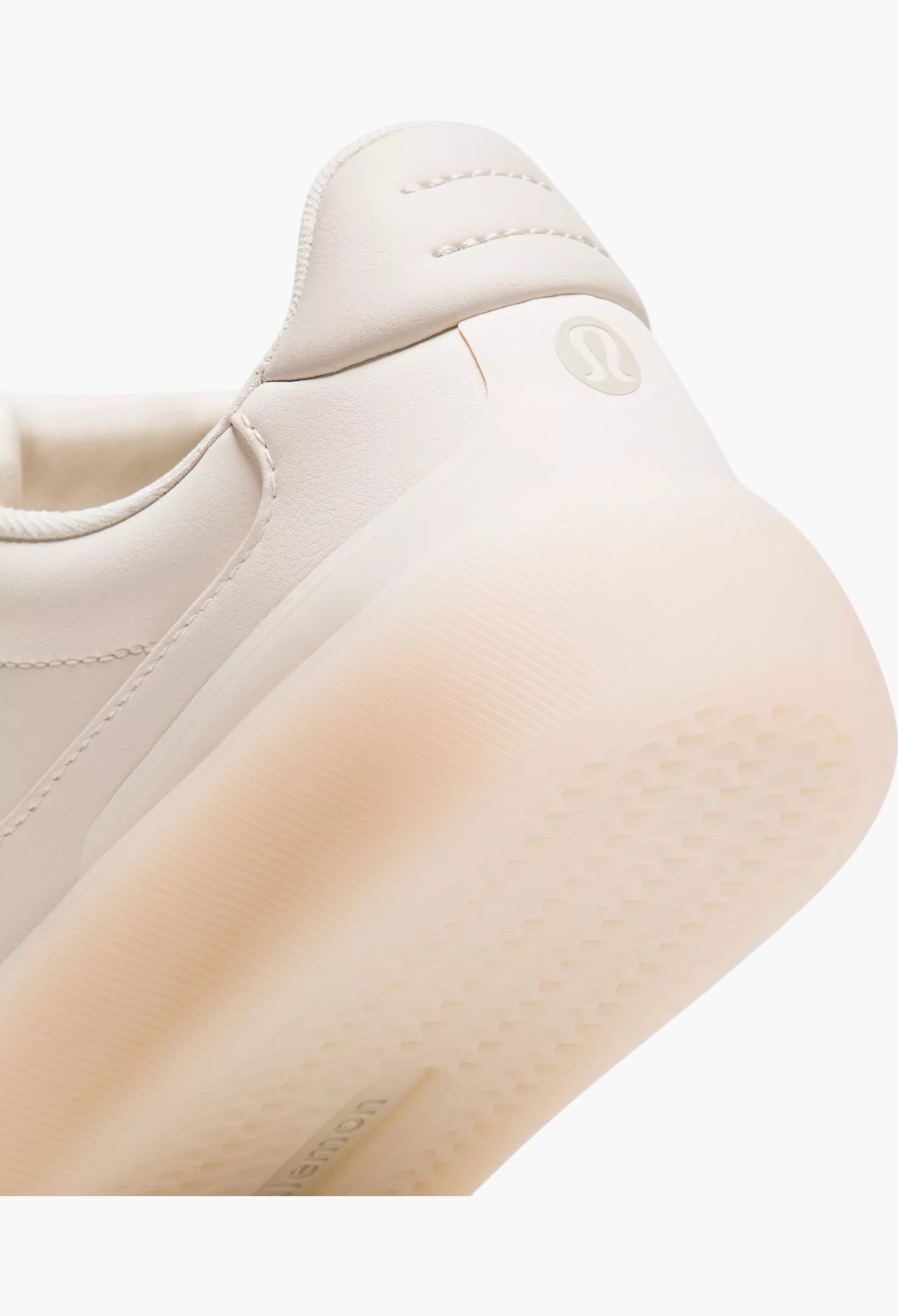 GLAM MODA Women's Cityverse sneaker heel detail in cream with textured rubber outsole and subtle logo branding.