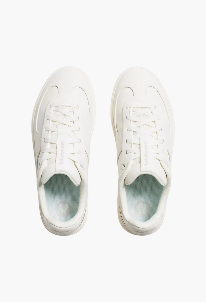 GLAM MODA Women's Cityverse white leather-alternative sneakers with exposed stitching and cushioned insoles.