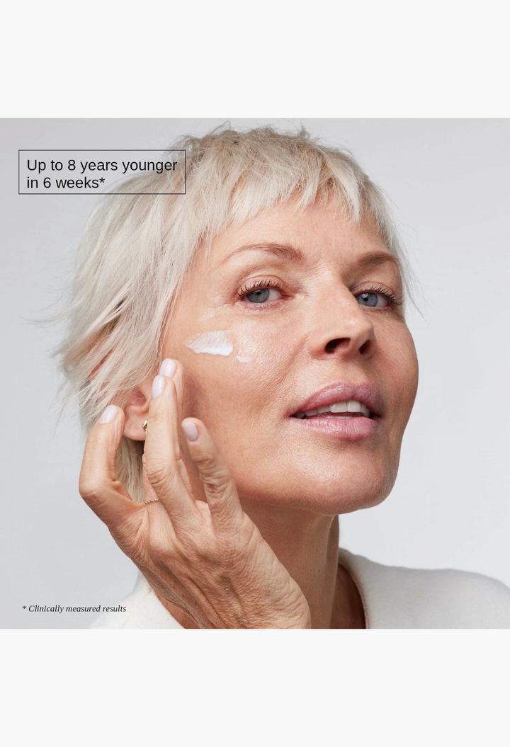 GLAM MODA La Cream Skin Longevity Crème applied to the cheek of a mature woman with radiant, healthy skin.