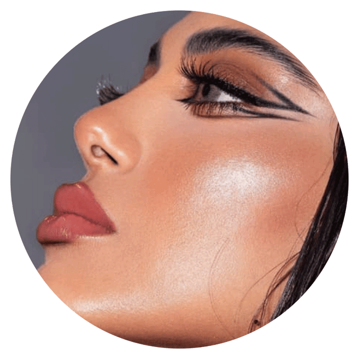 woman's face with dramatic makeup