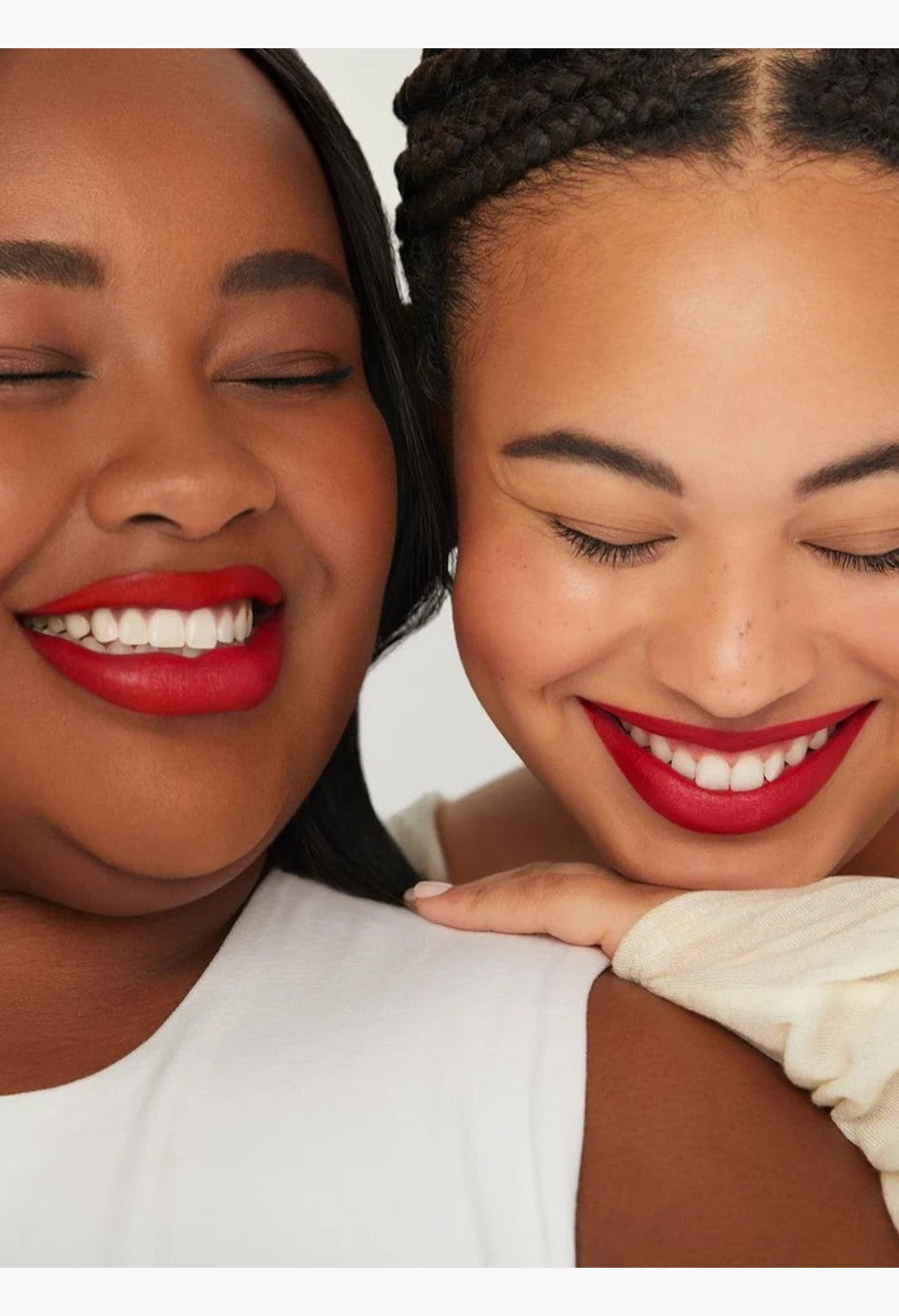 Two women smiling with GLAM MODA Kind Words Matte Lip Liner in Devoted true red shade on their lips