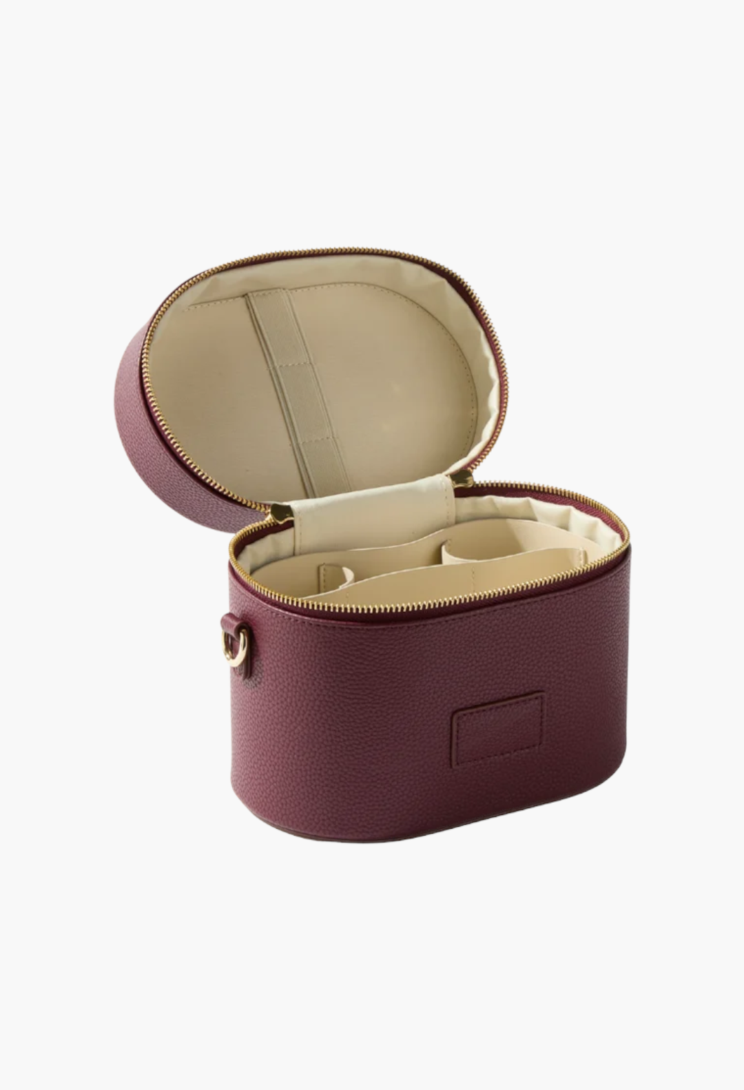 GLAM MODA oval toiletry case in burgundy vegan leather with a cream interior, removable divider, and gold zipper.