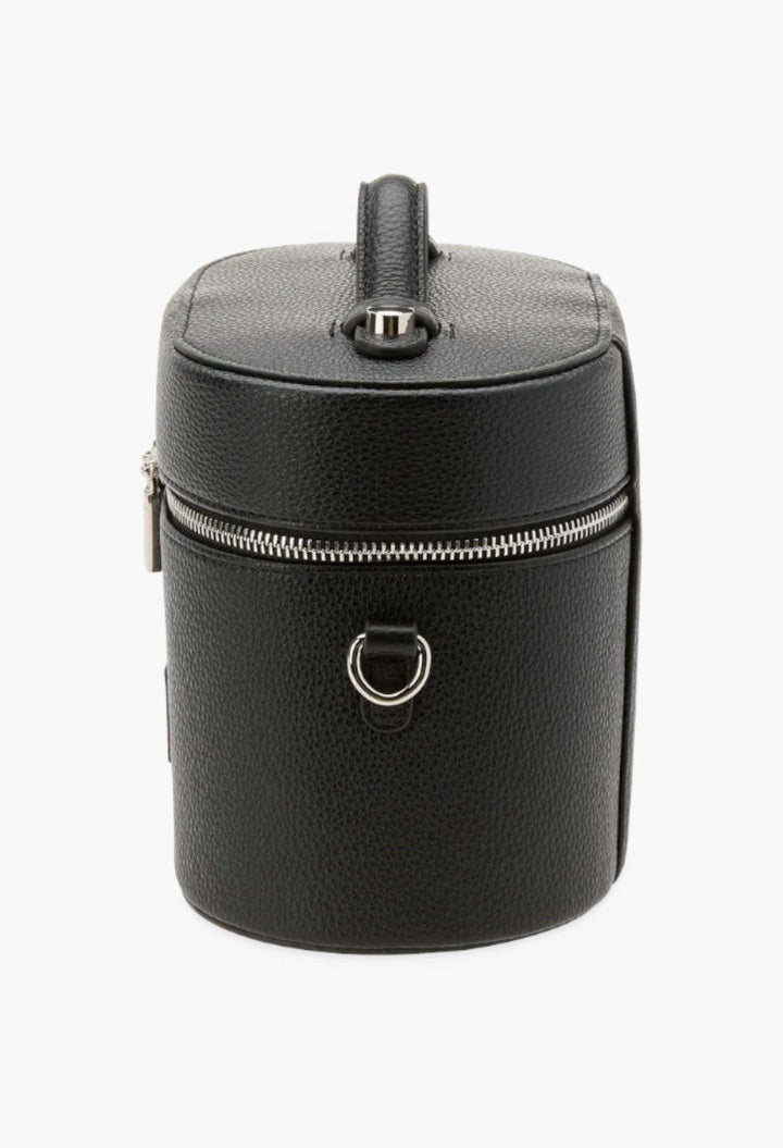 GLAM MODA black oval vegan leather toiletry case with a top handle, silver zipper, and shoulder strap attachment ring.