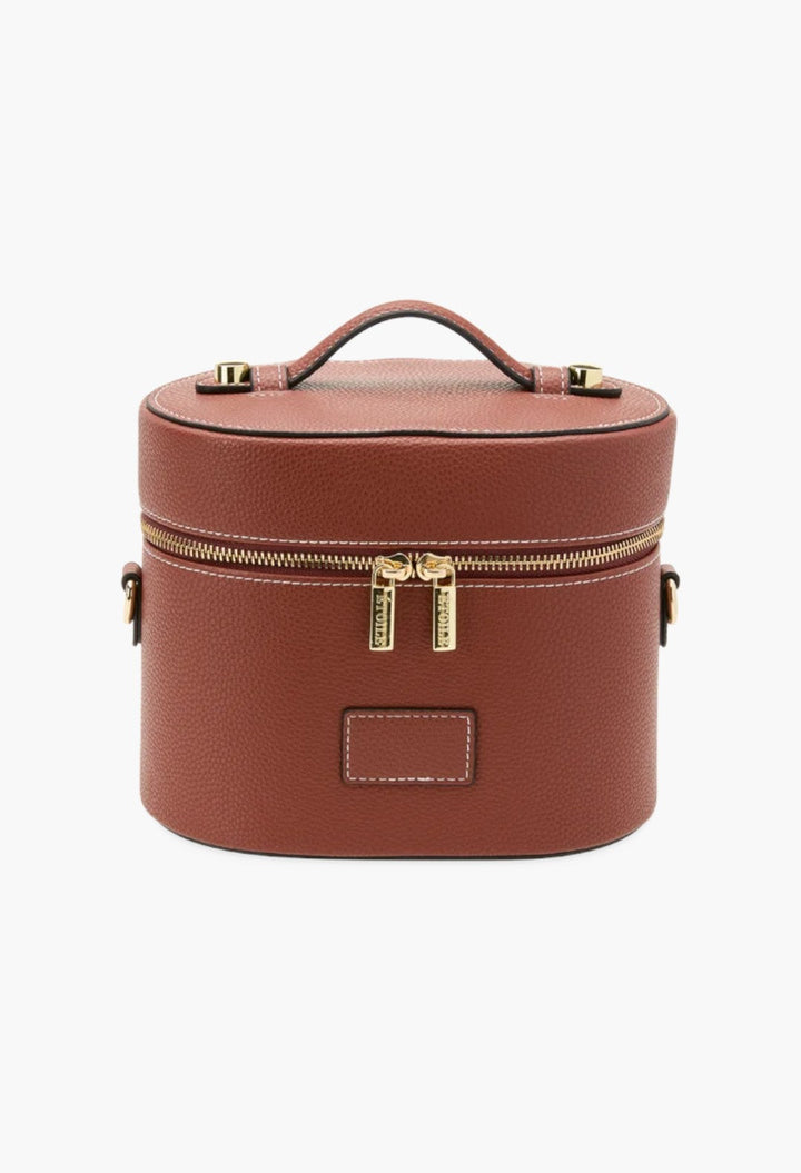 GLAM MODA oval toiletry case in brown vegan leather with gold dual zippers, top handle, and detachable strap.
