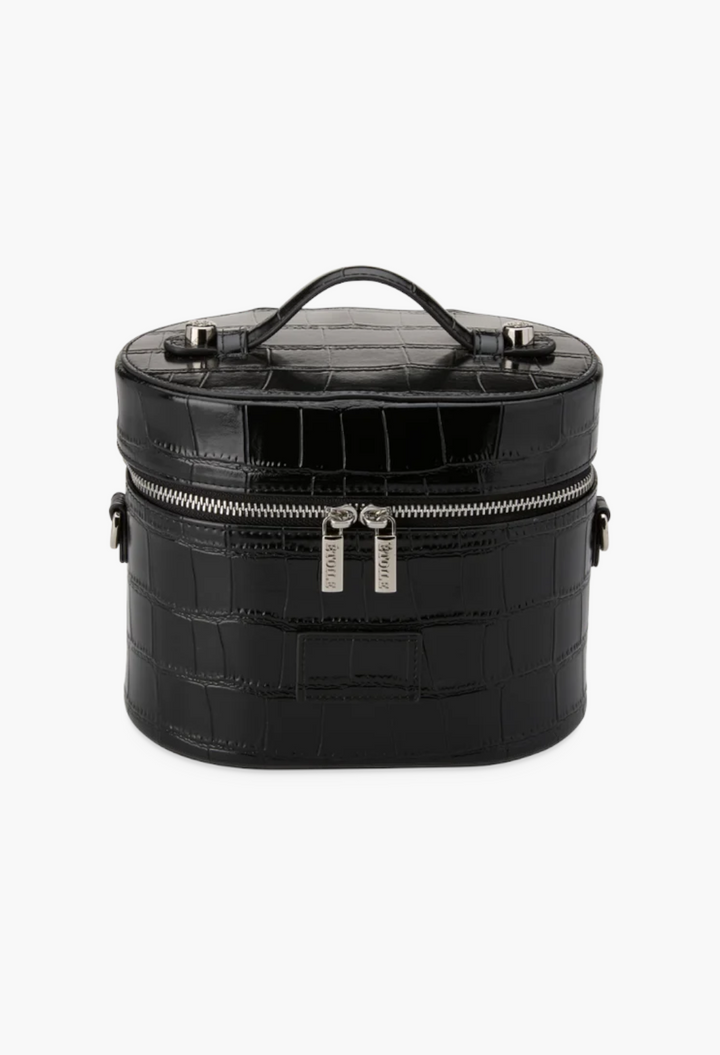 GLAM MODA black oval toiletry case in croc-embossed vegan leather with a top handle and dual silver zipper closure.
