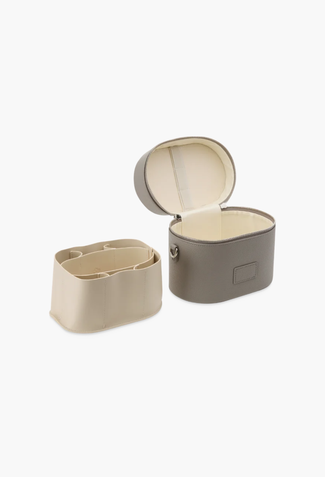 GLAM MODA oval vegan leather toiletry case in taupe with a removable cream divider insert and interior elastic loops.
