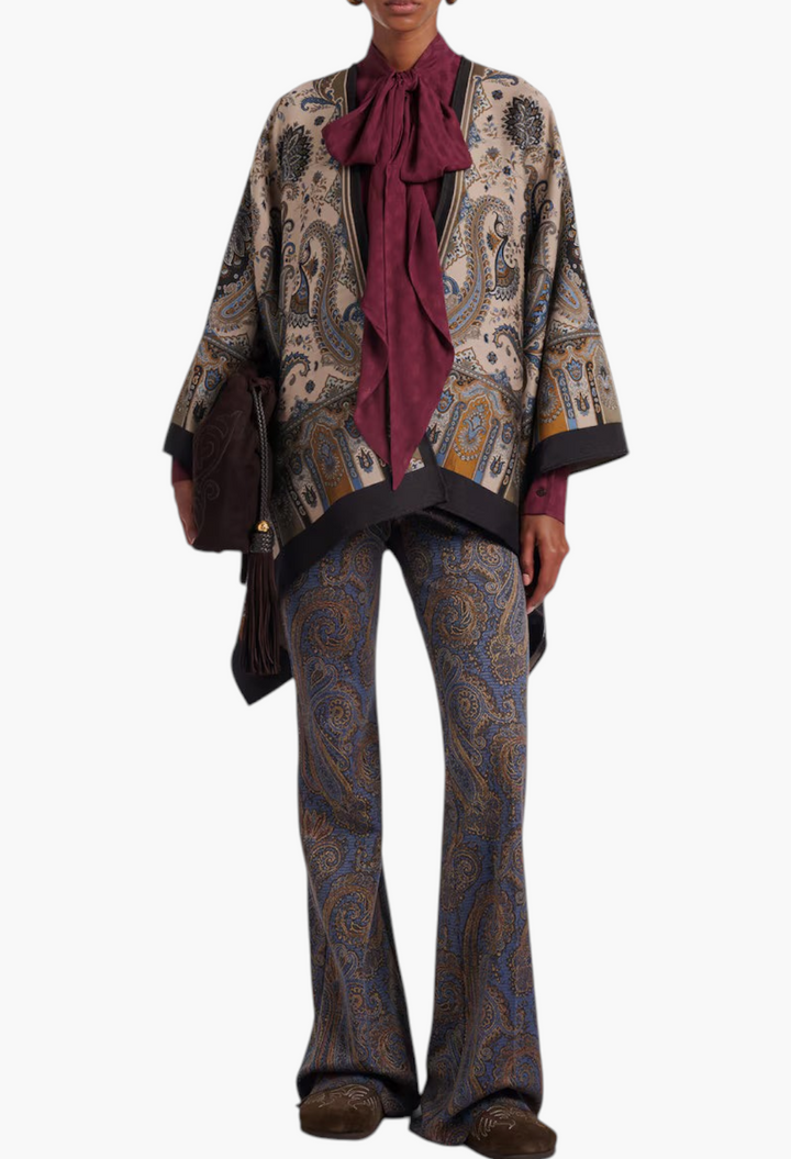 GLAM MODA Birkenstock Boston brown suede clogs with intricate embroidery worn by a model in a paisley outfit