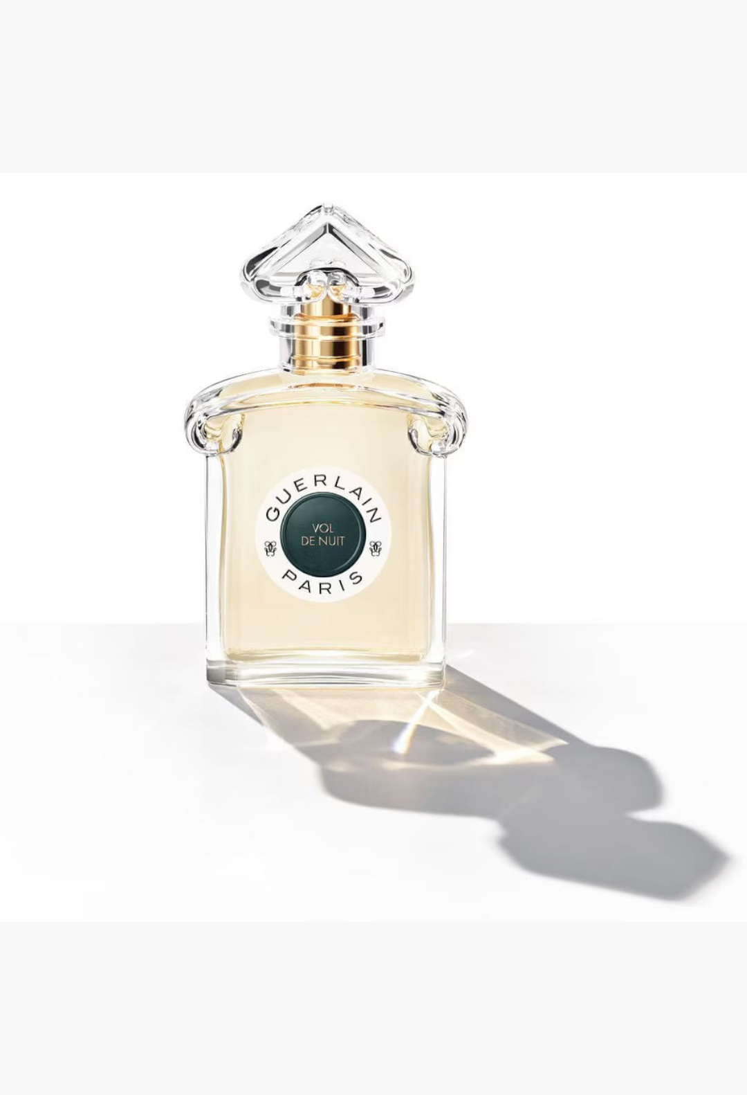 GLAM MODA Guerlain Vol de Nuit Eau de Toilette in an iconic inverted heart glass bottle with a dark green label.