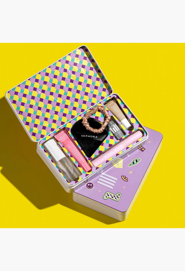 GLAM MODA beauty gift set featuring seven skincare and makeup essentials in a colourful patterned metal tin