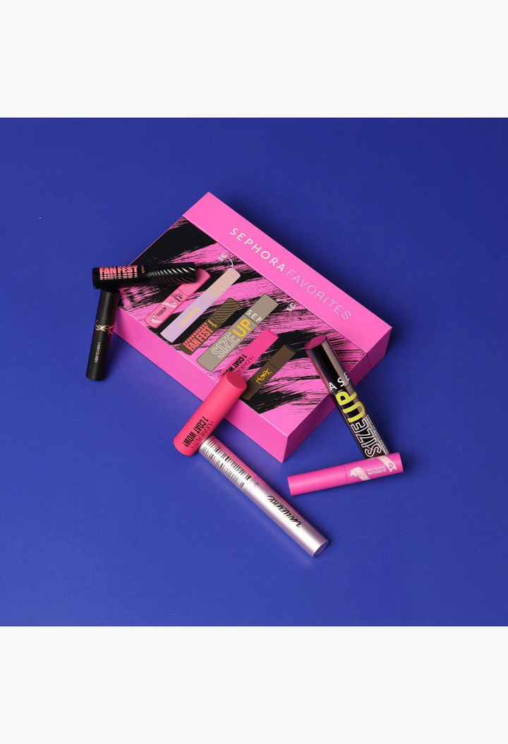 GLAM MODA Lash Drama set featuring six assorted luxury mascaras and a pink Sephora Favorites gift box on blue background