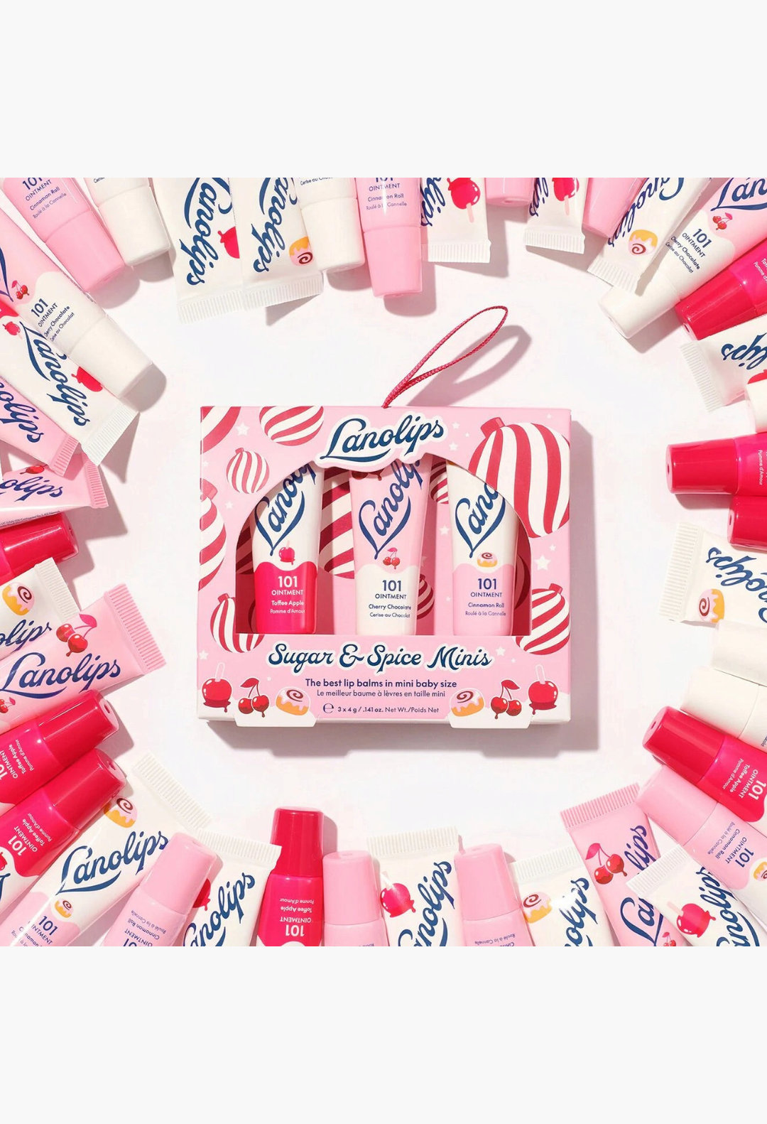 GLAM MODA Lanolips Sugar & Spice Minis gift set featuring three mini lip balms surrounded by scattered ointment tubes.
