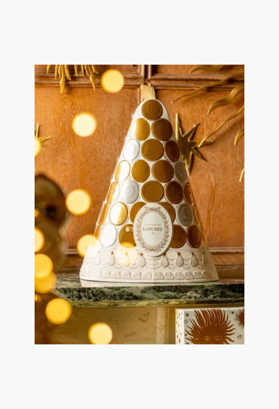 GLAM MODA Laduree 2026 advent calendar in a cone shape with gold and silver circular accents on a marble surface.