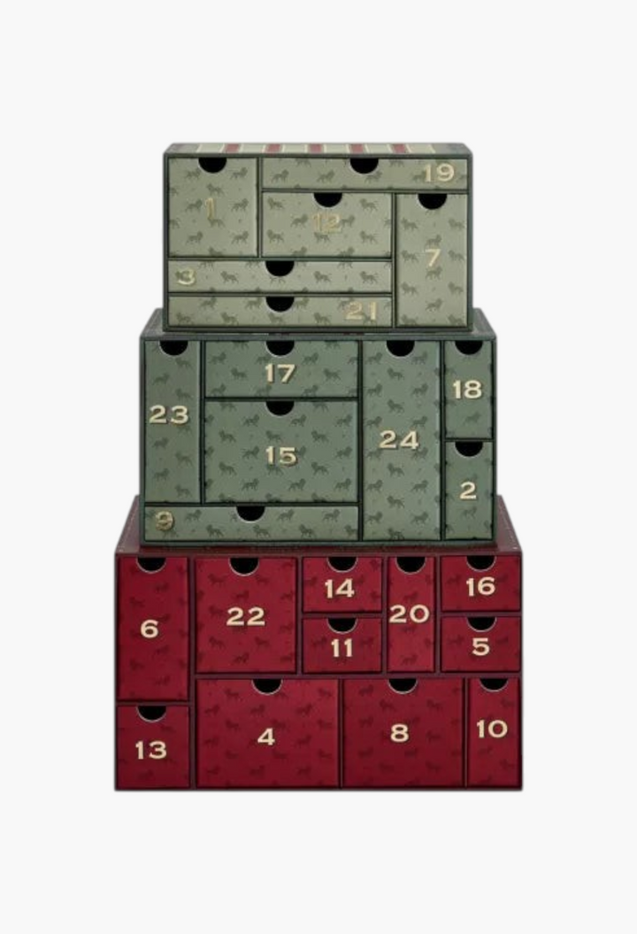 GLAM MODA Penhaligon's 2026 advent calendar featuring stacked green and red vintage-style drawers with gold numbering.