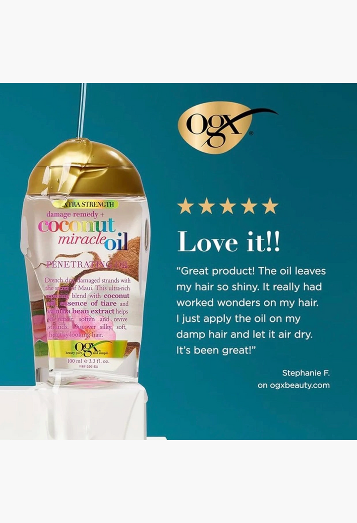 GLAM MODA OGX Coconut Miracle Oil hair treatment bottle with gold cap on a white pedestal against a teal background