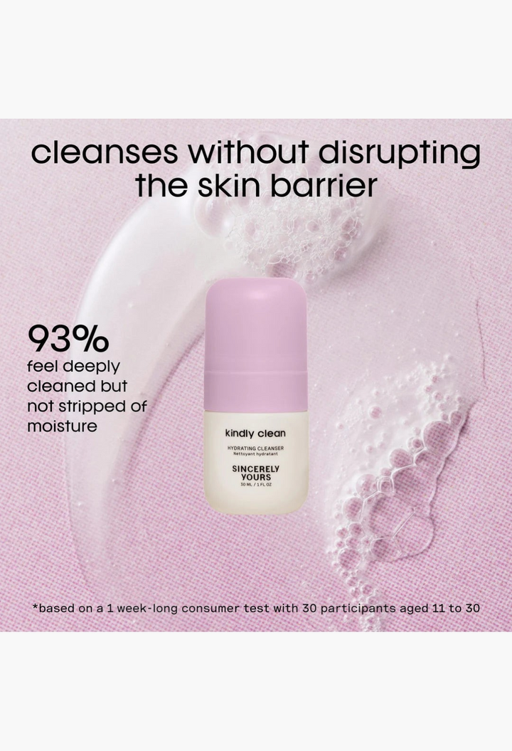GLAM MODA Kindly Clean hydrating cleanser mini bottle with light purple cap on a textured pink background