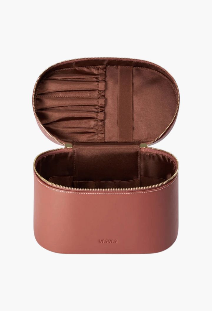 GLAM MODA espresso brown oval vegan leather vanity case with open lid and interior brush storage pockets