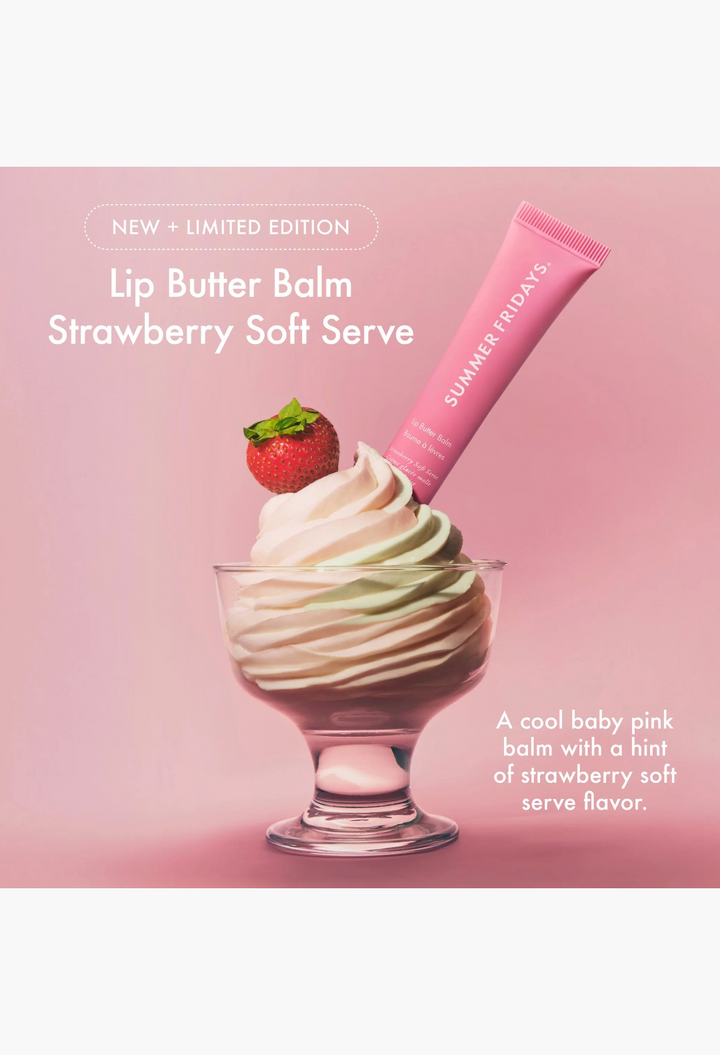 GLAM MODA lip butter balm tube in a pink glass bowl with strawberry soft serve ice cream and a fresh strawberry