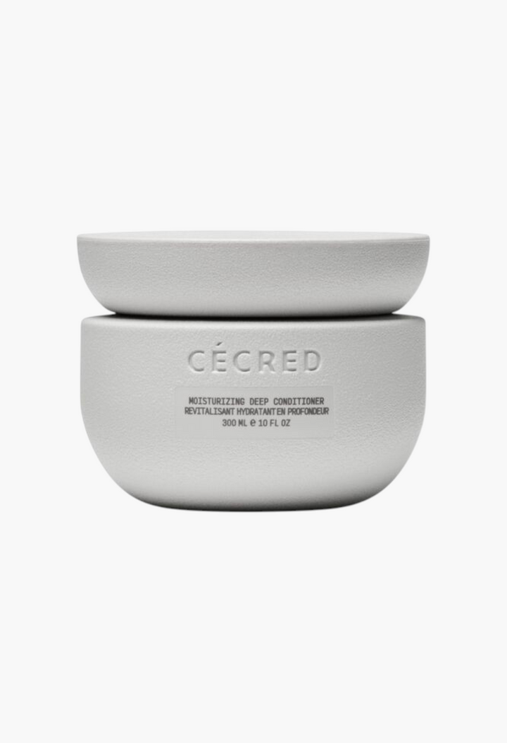 GLAM MODA CÉCRED Moisturizing Deep Conditioner in a minimalist white textured jar for curly and coily hair