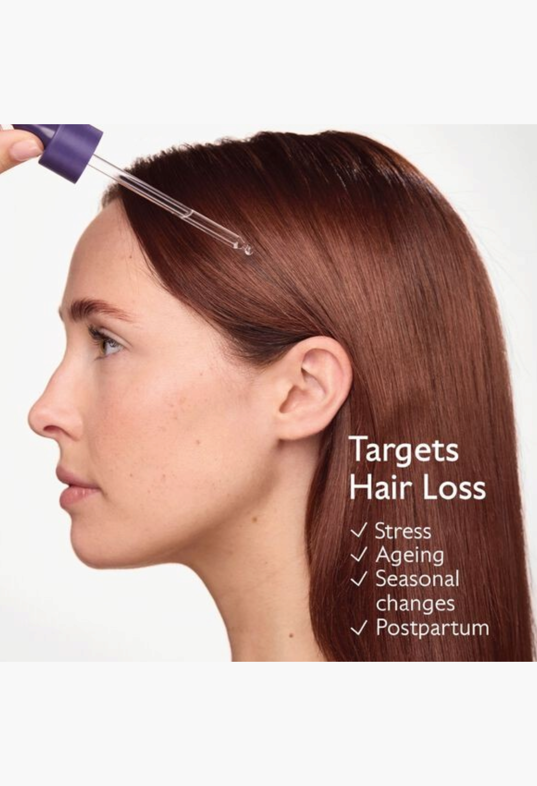 GLAM MODA anti-hair loss serum being applied with a pipette to the scalp of a woman with long auburn hair