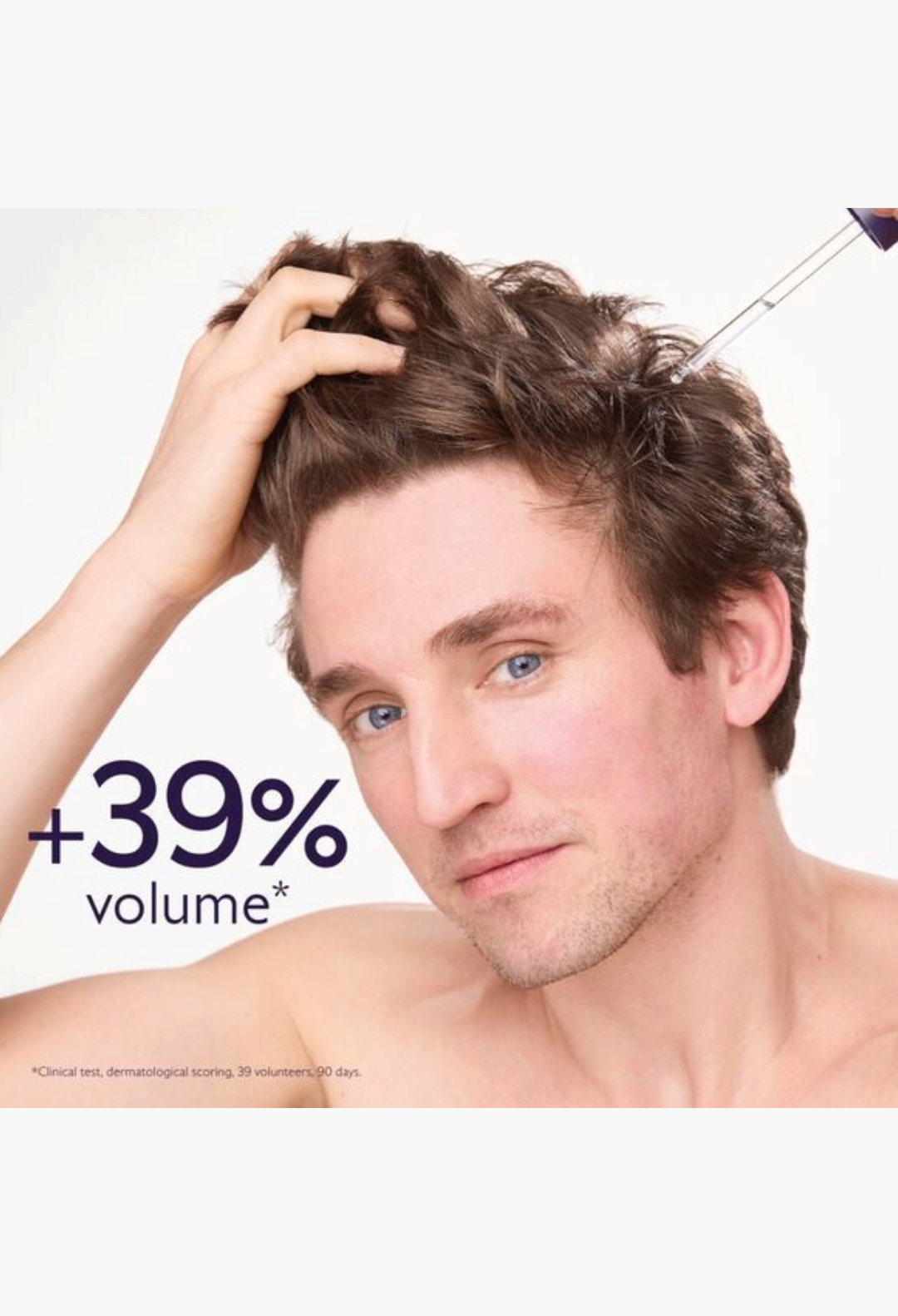 GLAM MODA anti-hair loss serum being applied to a man's scalp with a pipette for increased volume and hair density