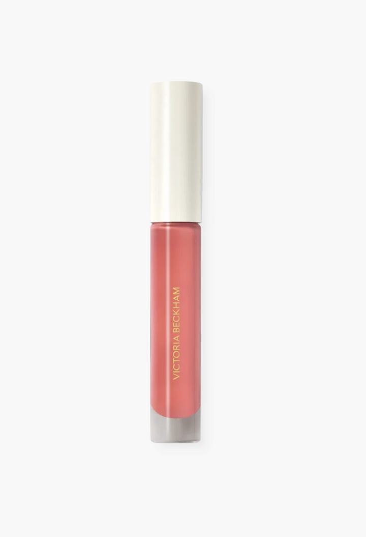 GLAM MODA Posh Gloss high-shine lip gloss in a soft pink shade with a sleek applicator tube and gold branding.