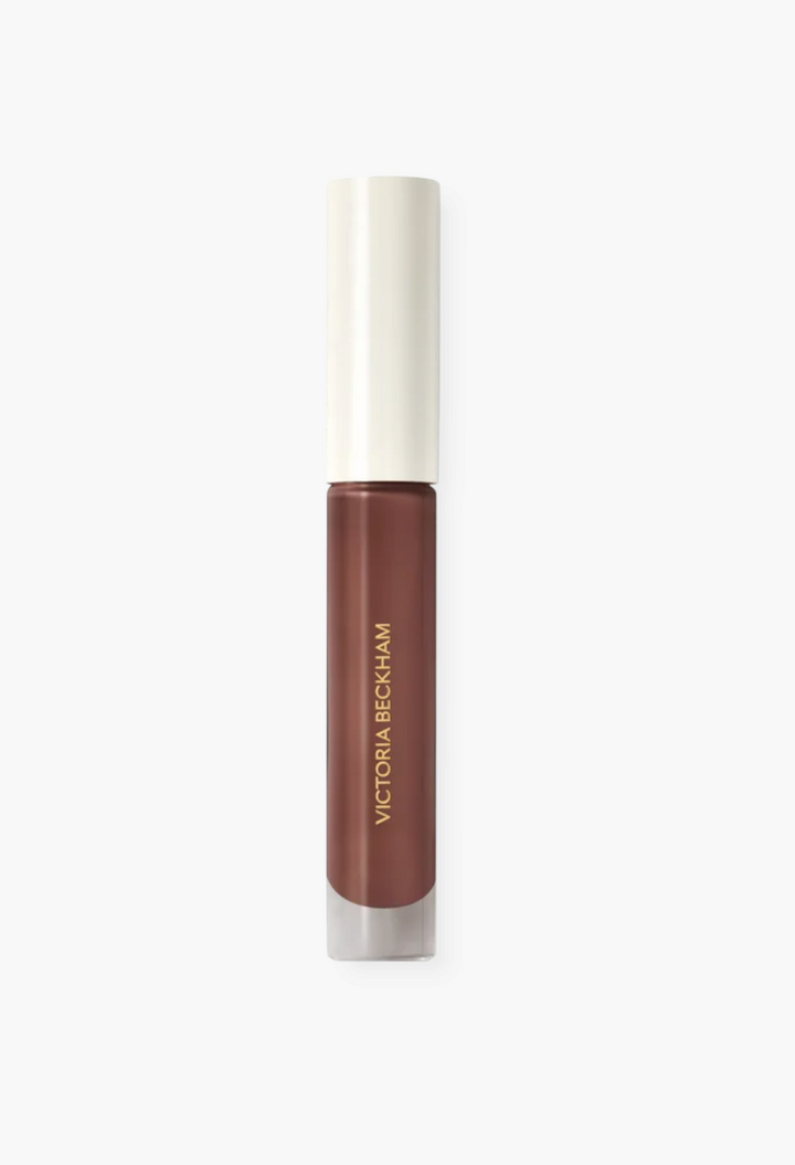 GLAM MODA Posh Gloss high-shine lip gloss in a rich brown shade with a sleek applicator tube and white cap.