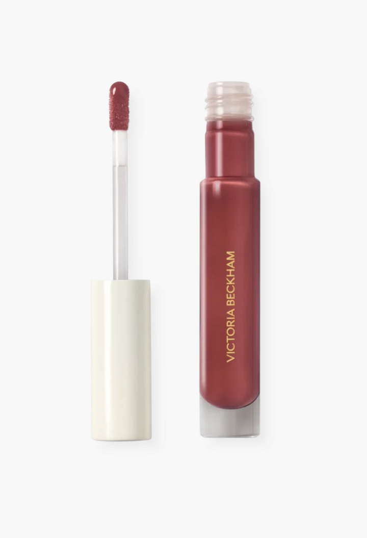 GLAM MODA Posh Gloss High Shine Lip in a deep mauve shade with a doe foot applicator and sleek glass tube packaging.