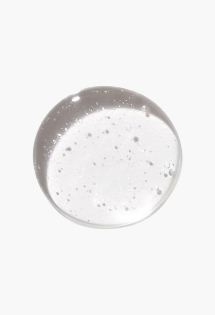 GLAM MODA rosemary mint purifying shampoo texture showing a clear, viscous liquid drop for normal to oily hair.