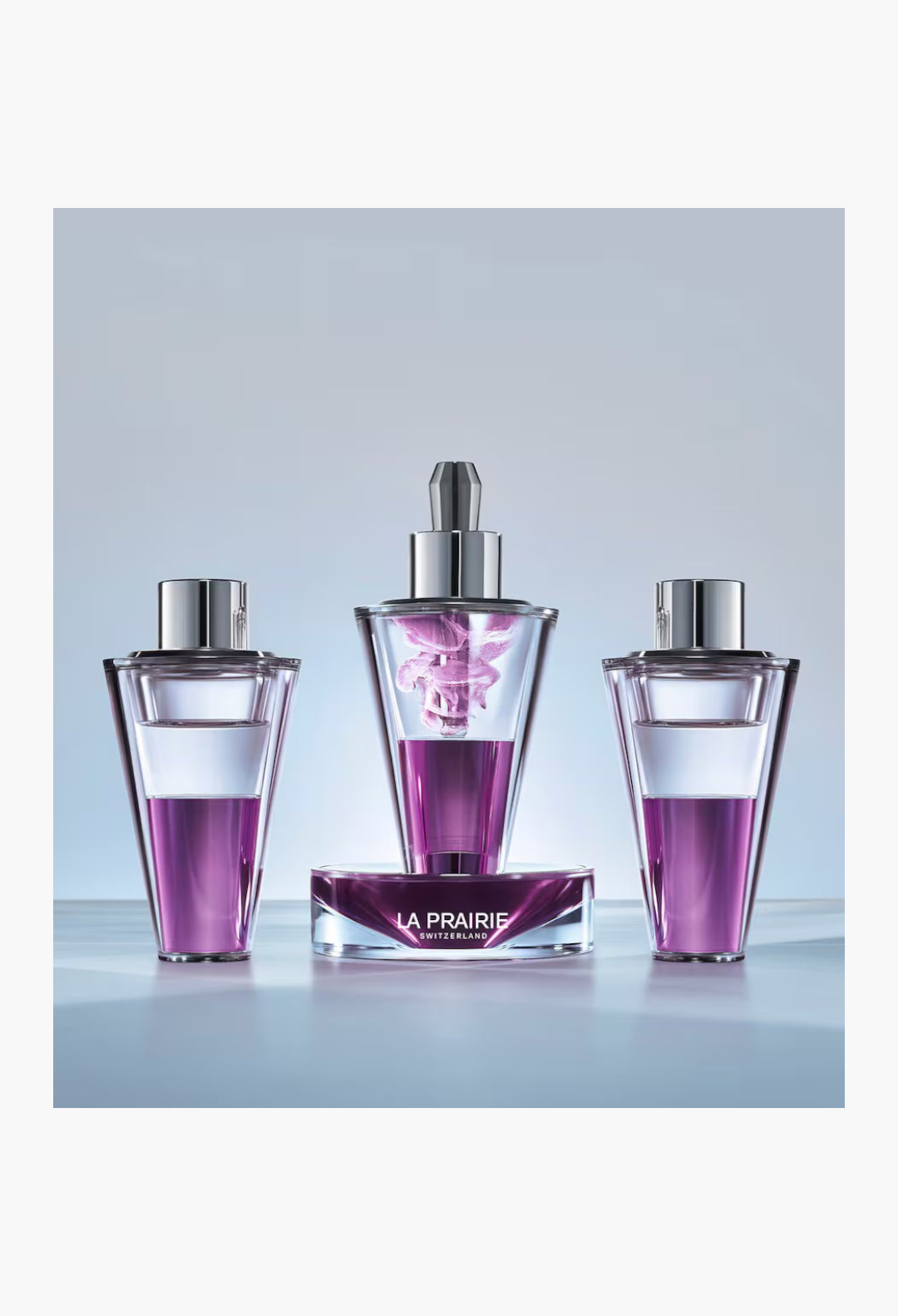 GLAM MODA La Prairie Platinum Rare Haute-Rejuvenation Protocol set featuring three purple serum vials and a base.