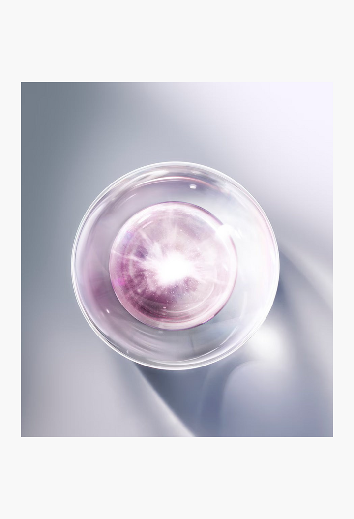 GLAM MODA Platinum Rare Haute-Rejuvenation Protocol serum vial with a glowing purple center on a silver background.