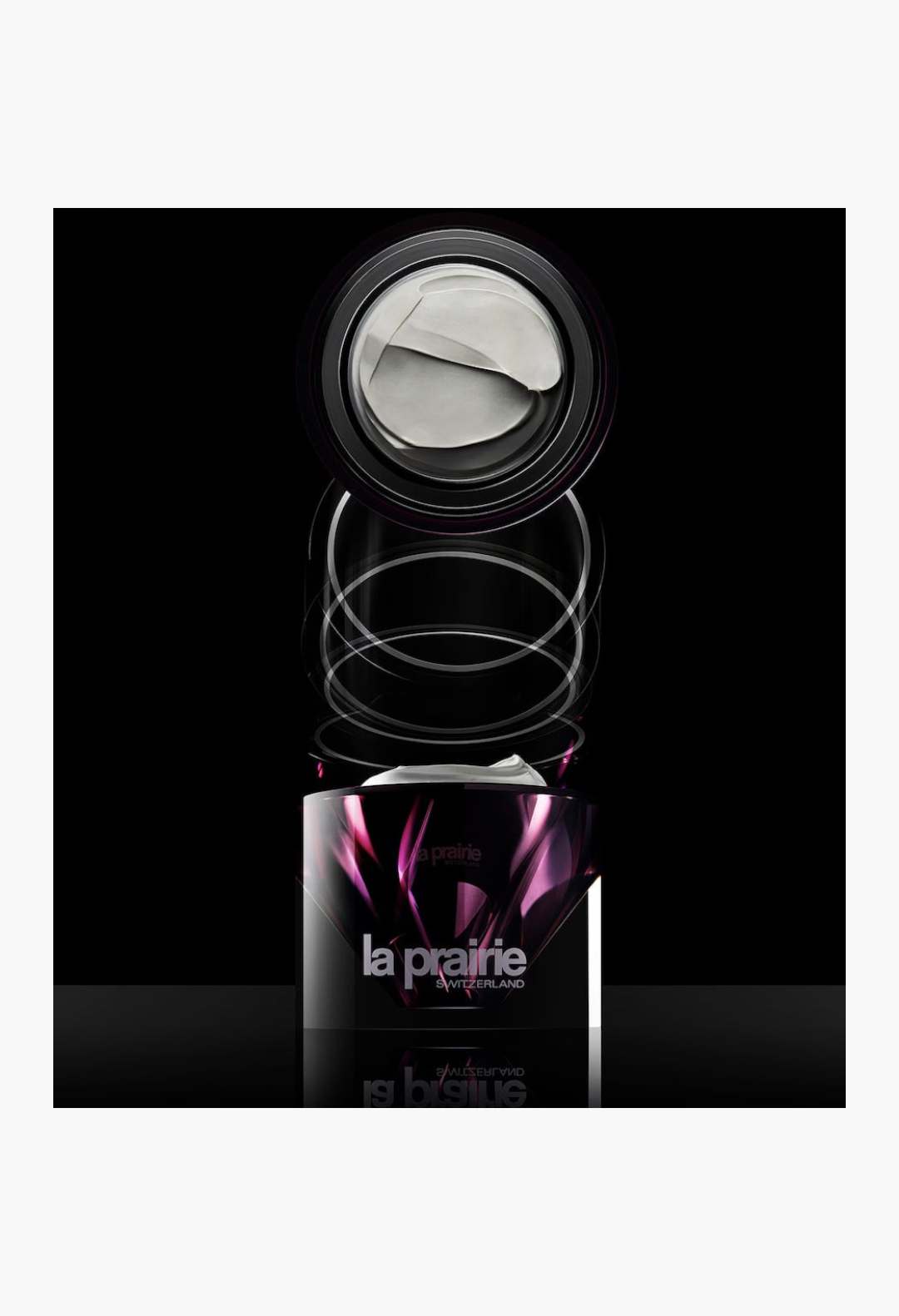 GLAM MODA La Prairie Platinum Rare Haute-Rejuvenation Cream in a sleek, dark purple jar with a rich white face cream.