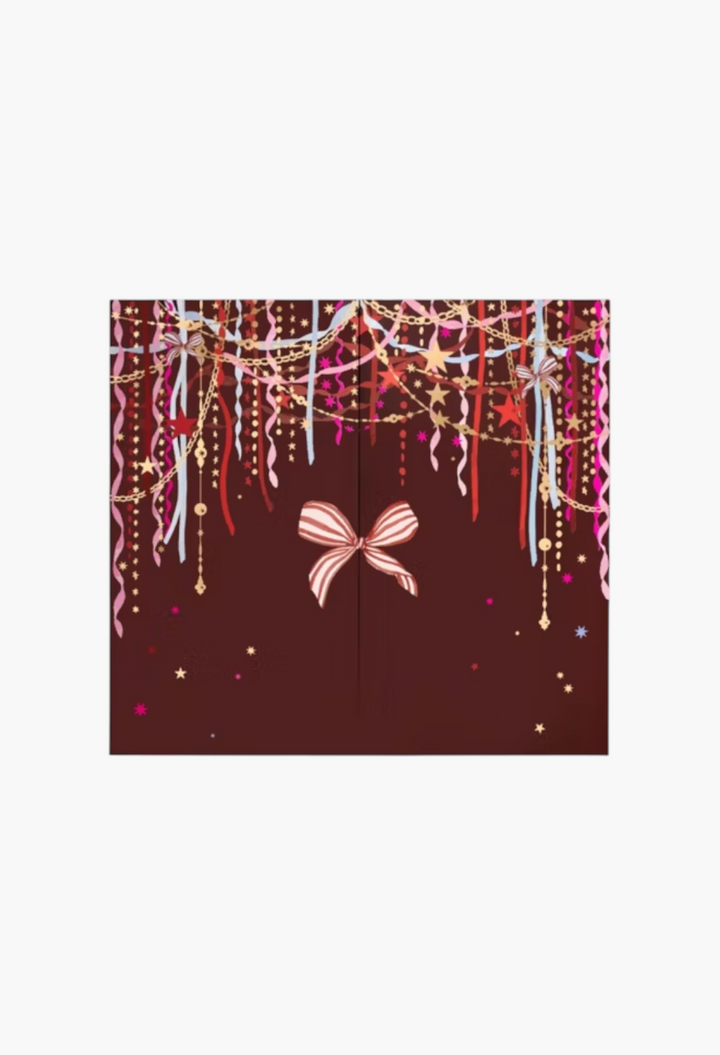 GLAM MODA 24 Days of Luxe Beauty Advent Calendar with festive dark red design, gold chains, ribbons, and a central bow.