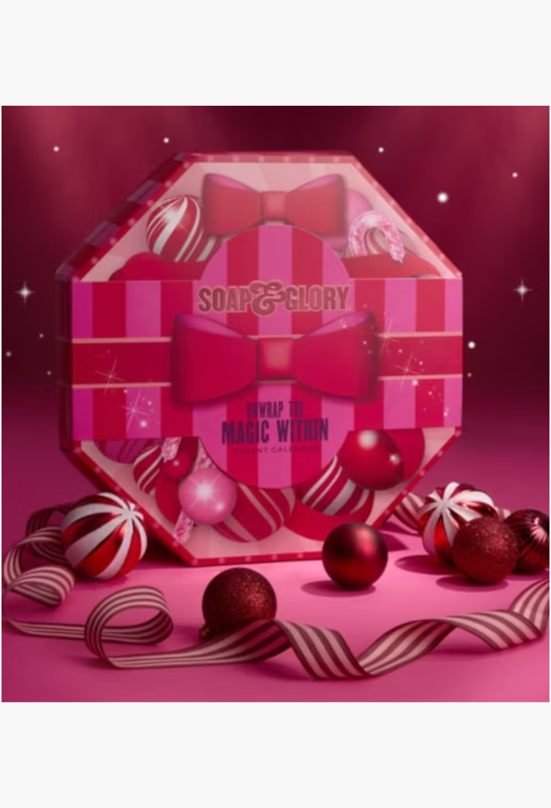 GLAM MODA Soap & Glory 24-piece advent calendar in a festive pink striped box with bows and holiday ornaments.