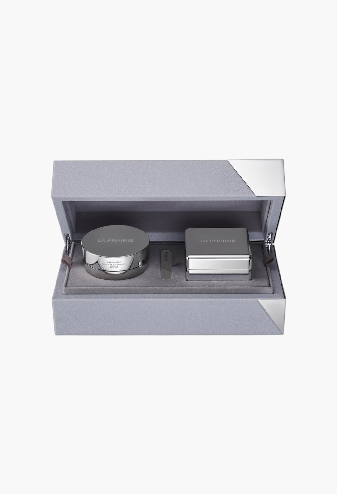 GLAM MODA La Prairie Life Matrix Longevity Capsule set featuring a rejuvenation cream jar and massager in a grey case.