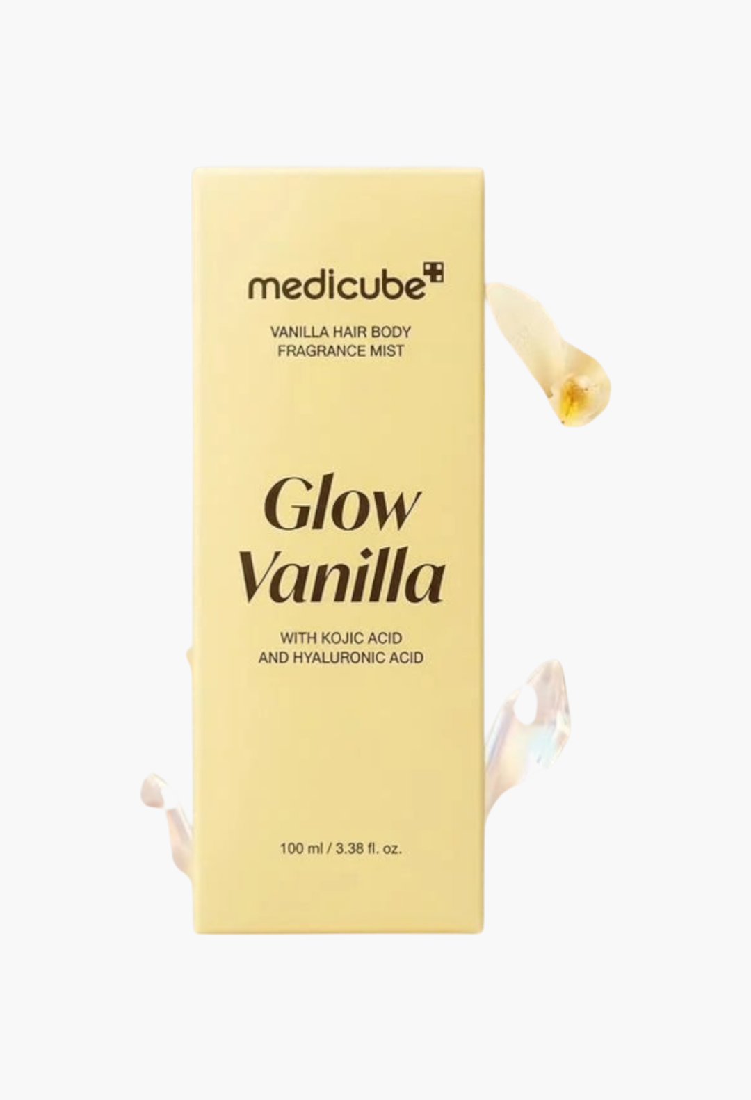 GLAM MODA Medicube Glow Vanilla hair and body fragrance mist bottle surrounded by vanilla flowers and crystals