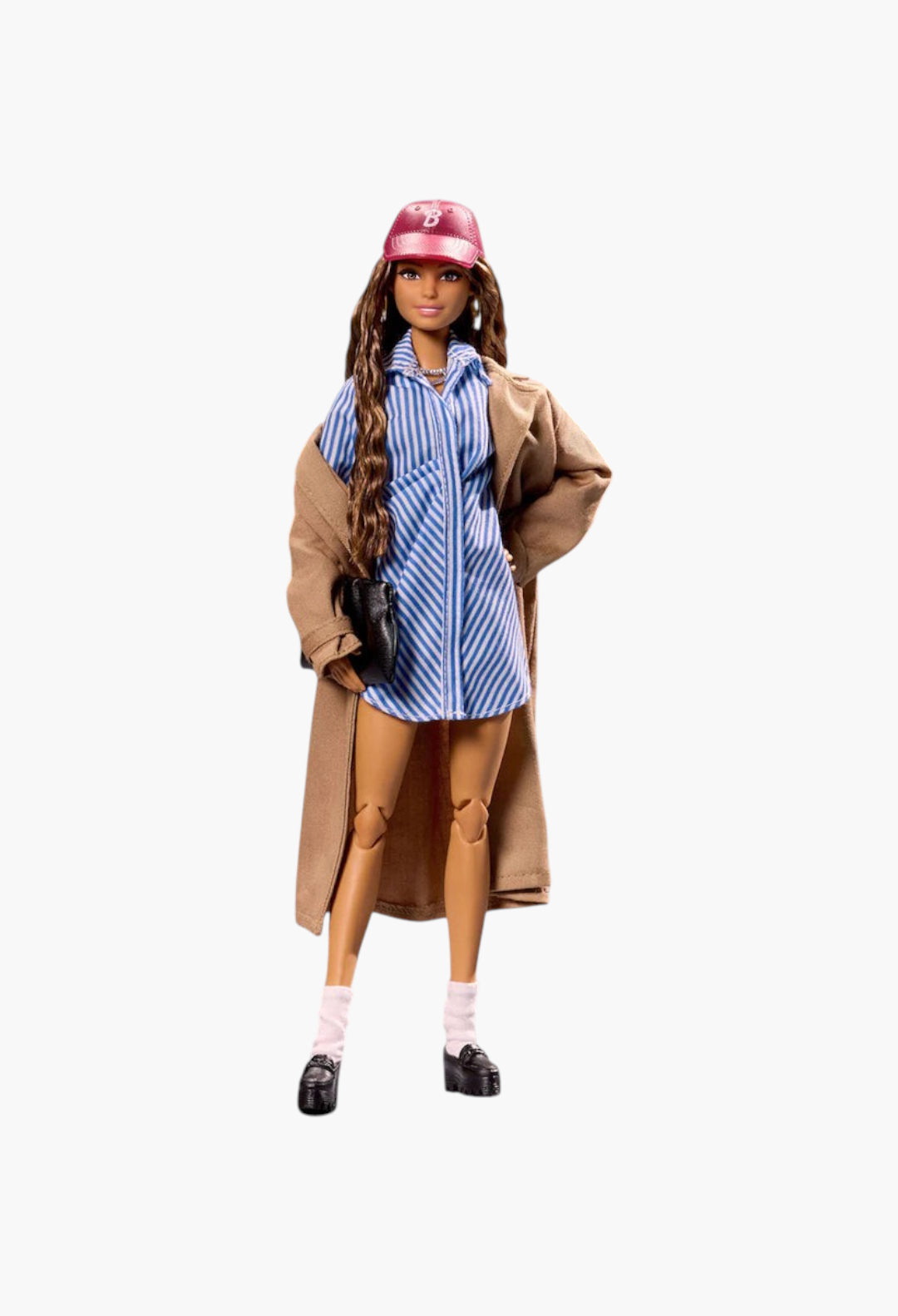 GLAM MODA New York Fashion Week Barbie doll wearing a blue striped shirt dress, tan coat, and pink baseball cap.