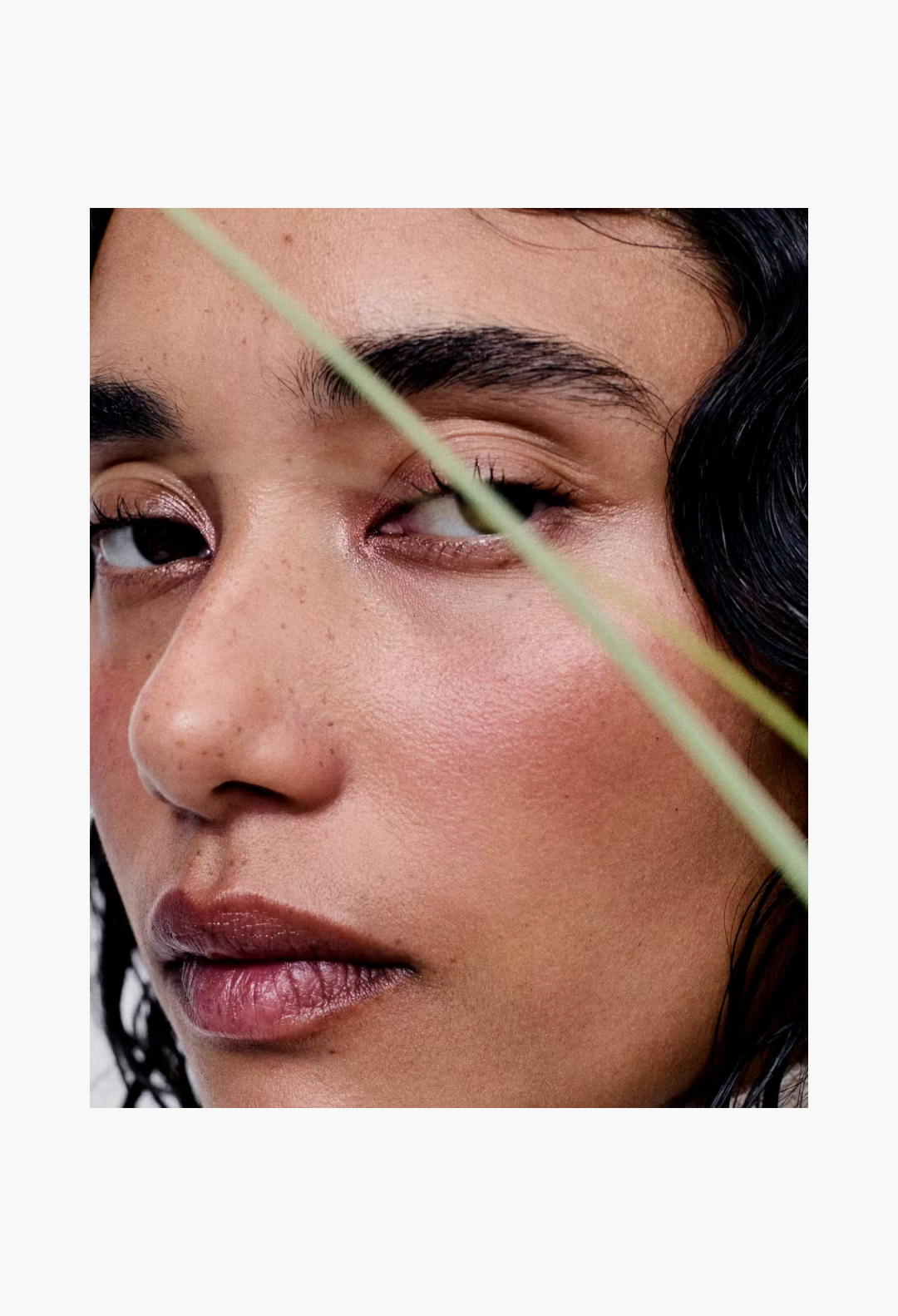 Close-up portrait of a woman with natural makeup for GLAM MODA Glossier You Doux woody skin-scent fragrance campaign