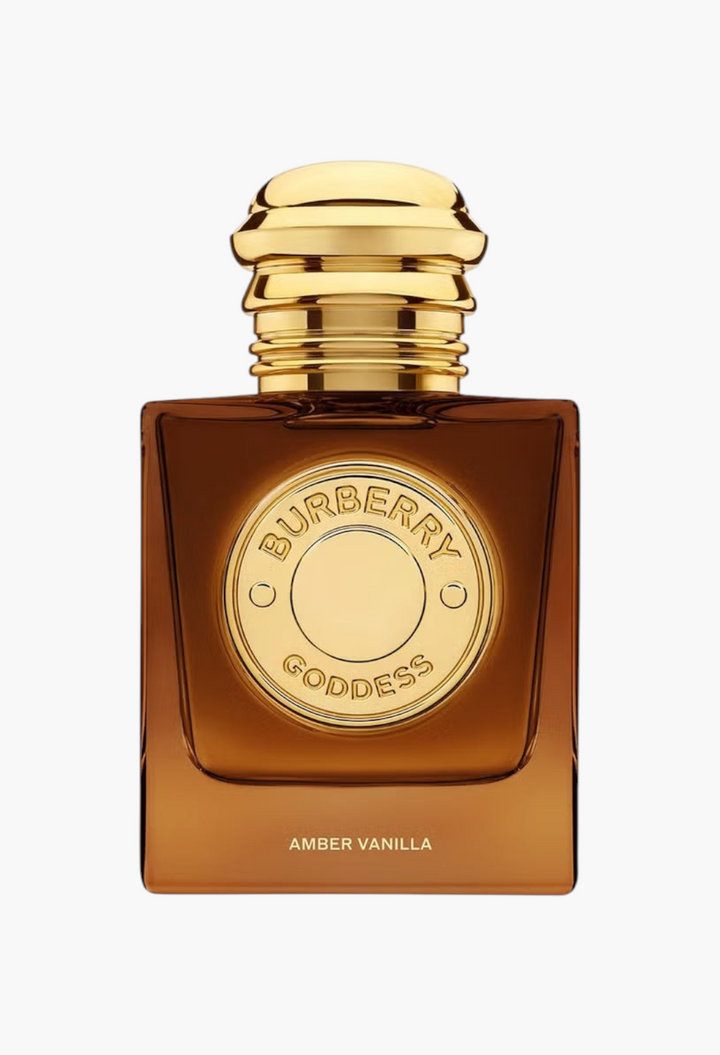 GLAM MODA Burberry Goddess Amber Vanilla perfume in a square amber glass bottle with a gold cap and medallion.