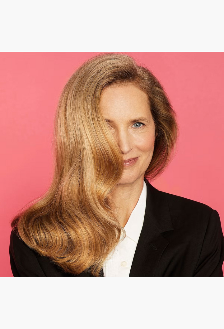 GLAM MODA model with voluminous blonde hair styled with Hair By Sam McKnight Cool Girl Body Volumising Cream
