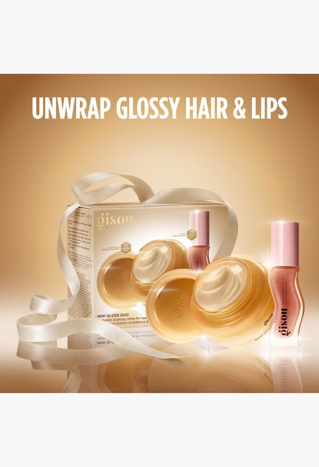 GLAM MODA Gisou Mini Gloss Duo set featuring a honey-infused hair mask and Glazed Plum lip oil in elegant packaging.