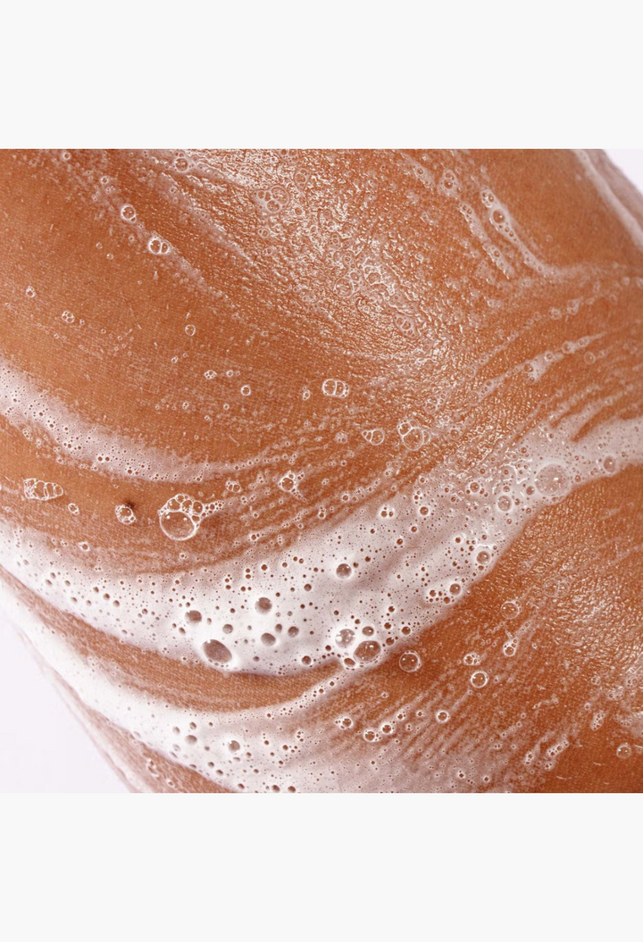 GLAM MODA Megababe Bidet Bar feminine cleansing soap lathering on skin for gentle pH balanced intimate care