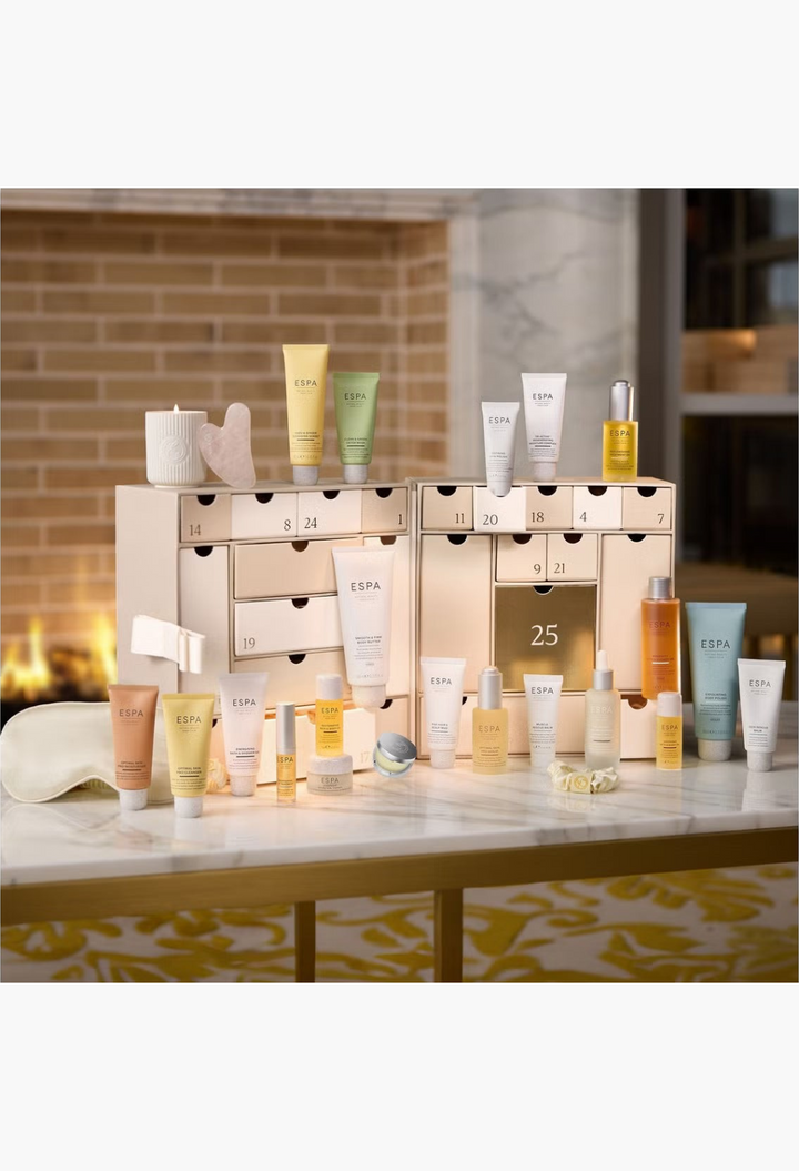 GLAM MODA ESPA Moments of Wellness Advent Calendar featuring 25 skincare, body, and aromatherapy treats on a marble table