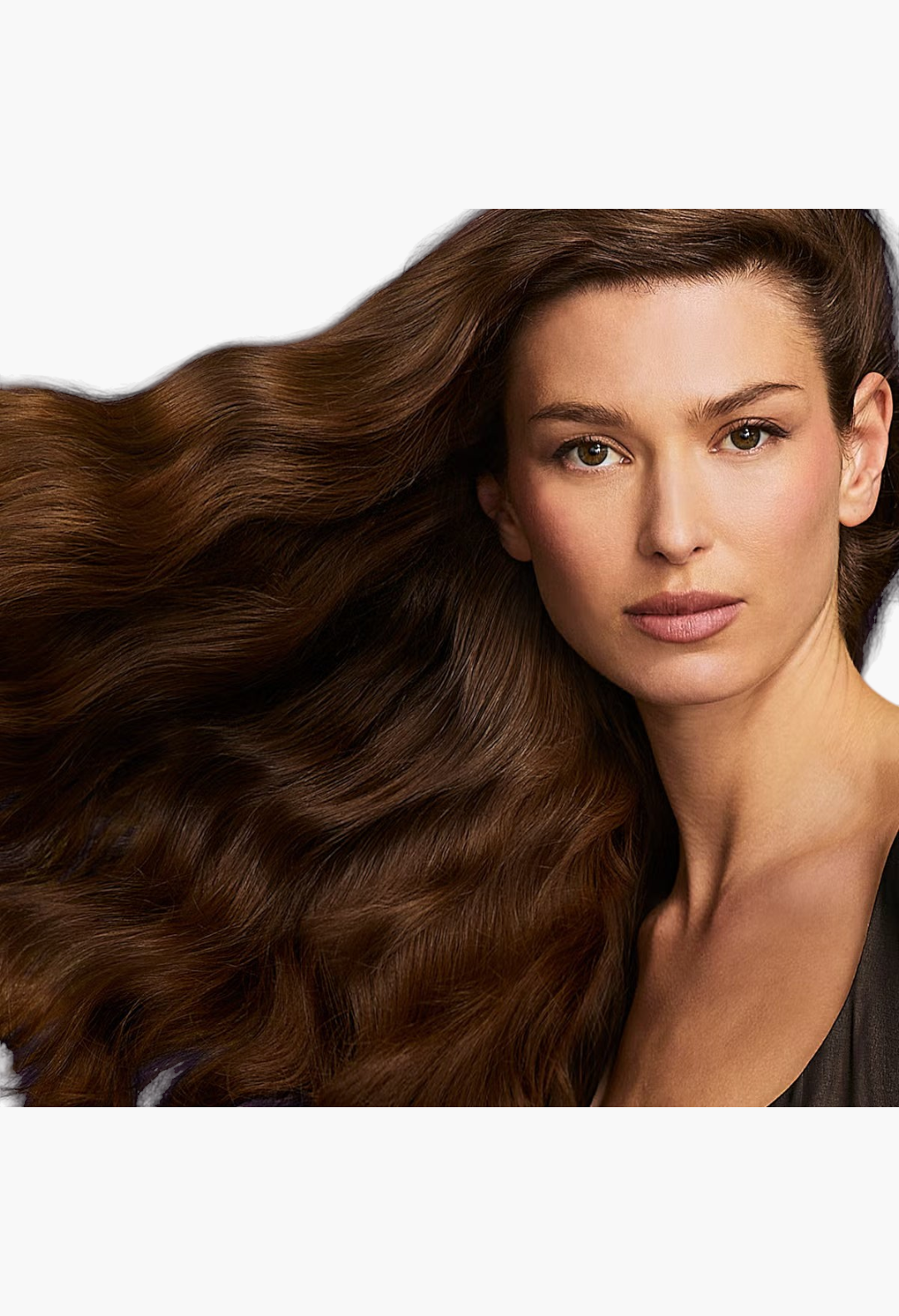 GLAM MODA model with long, voluminous, healthy brown hair showcasing the results of Hair by Sam McKnight repair spray