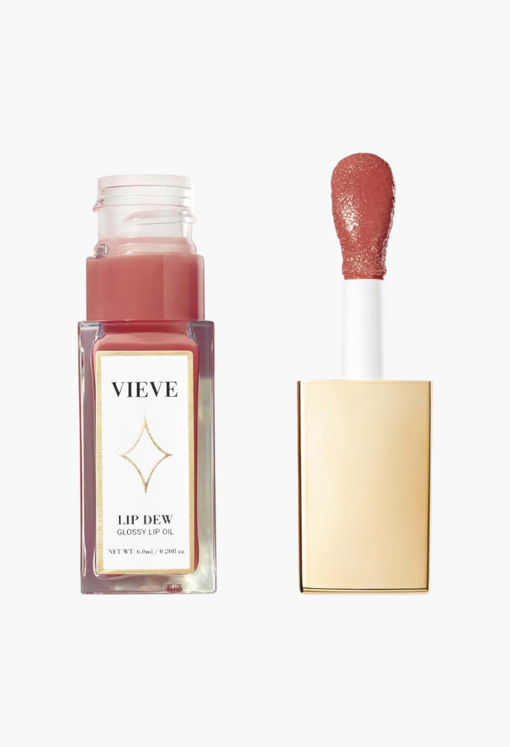 GLAM MODA VIEVE Lip Dew glossy lip oil in a clear glass bottle with a gold applicator wand and soft pink tint