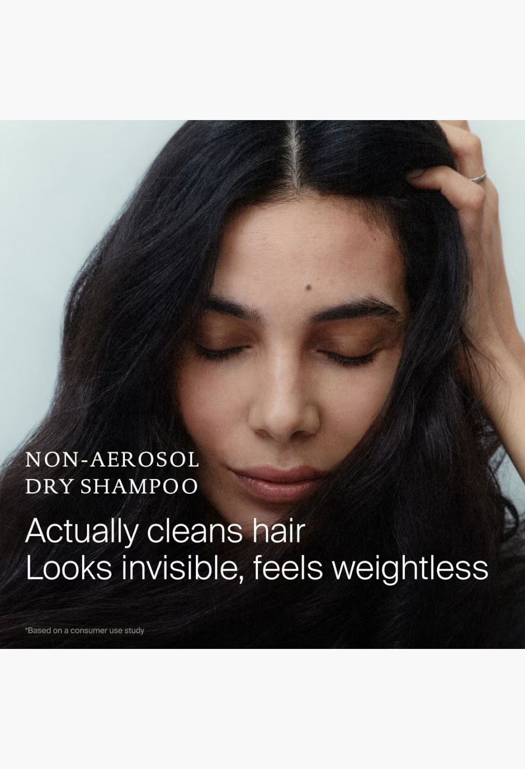GLAM MODA Living Proof Perfect Hair Day Sheer Clean Dry Shampoo Mist on a woman with dark hair